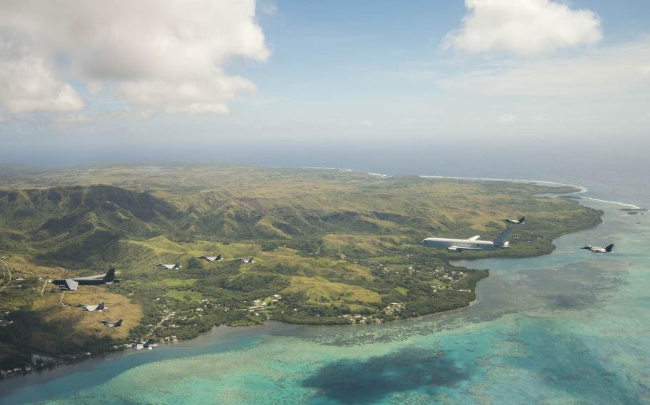 Aircraft flying over Guam photo