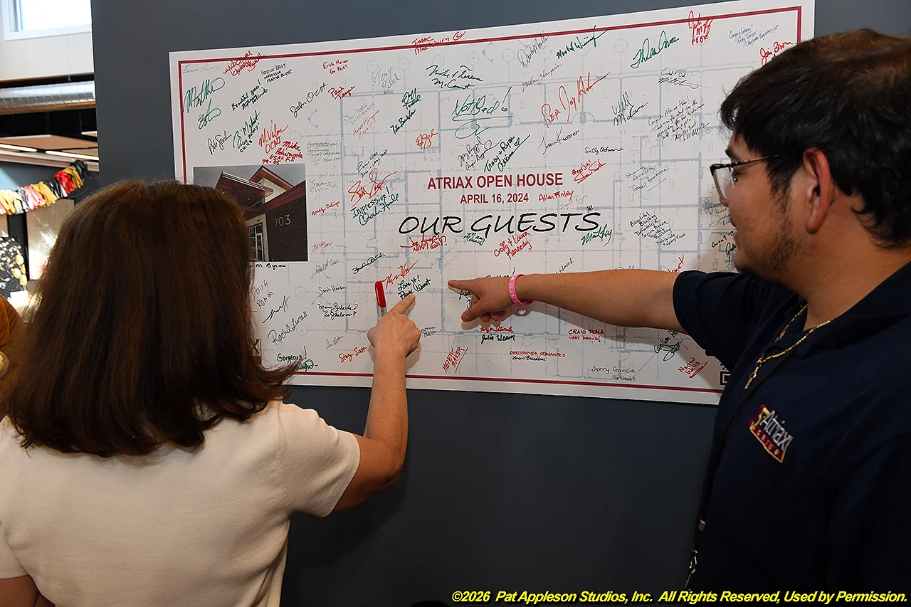 Fernando at open house board