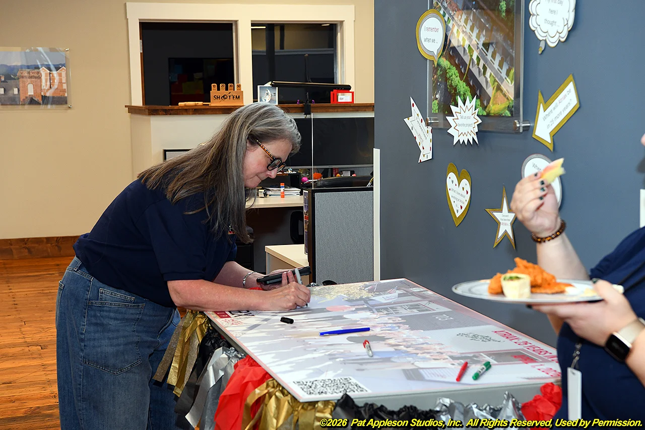 Mary at Anniversary board