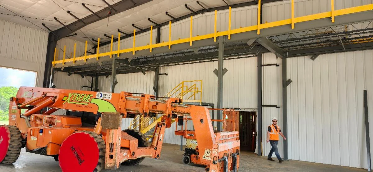 Raymond inspecting vehicle bays