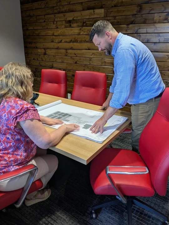 Sally and Mike in meeting